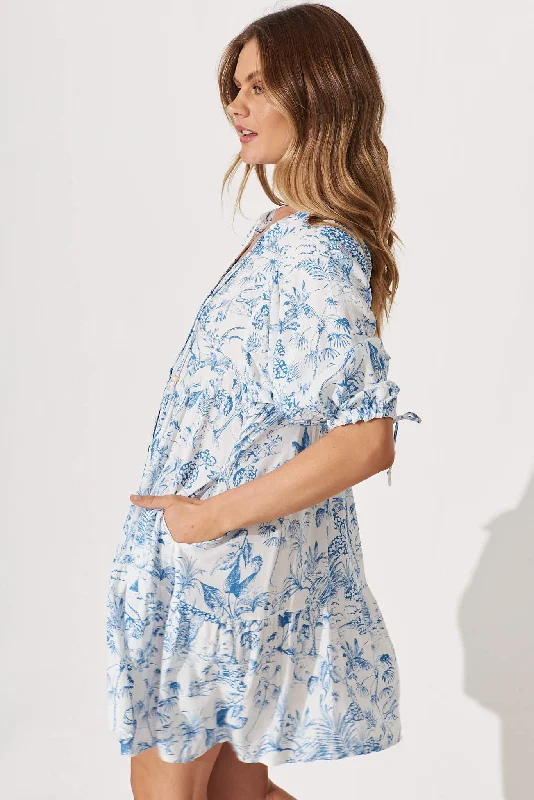 emelyn-dress-in-white-with-blue-palm-print